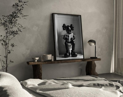 Black Kaws Figure Sitting on the Toilet Reading a Newspaper, Kaws Poster No Frame
